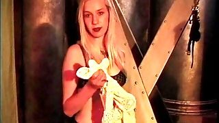 Sexy Blonde Is Shackled In Crimson And Has Clips Applied By Sadomasochist